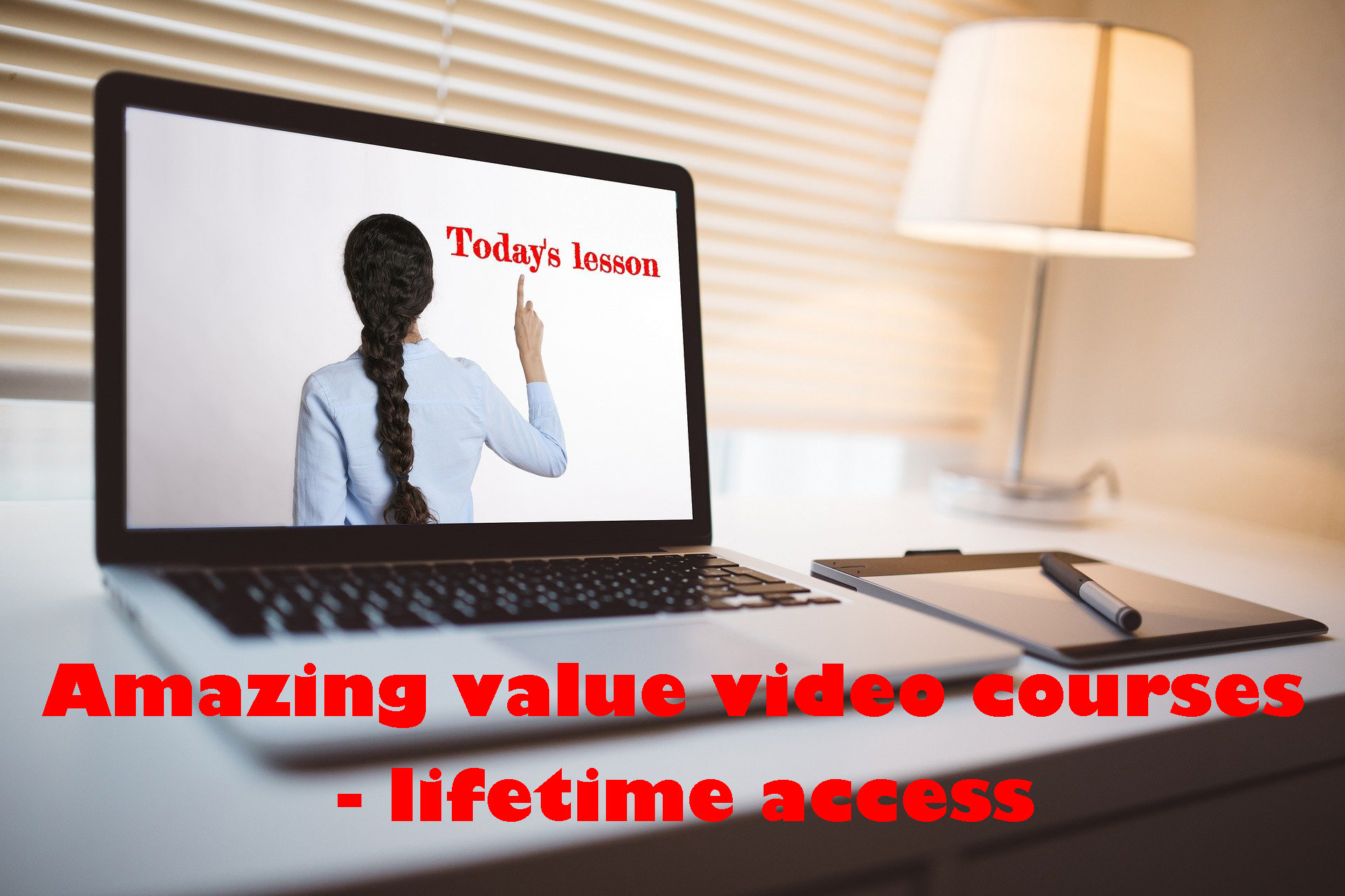 Laptop open to show the back of a woman with a long plait, pointing at red text reading "Today's lesson". Overlay of red text reading, "Amazing value video courses - lifetime access"."